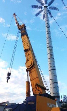 Crane erecting a lattice tower