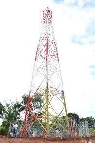 Red and white telecommunications lattice tower